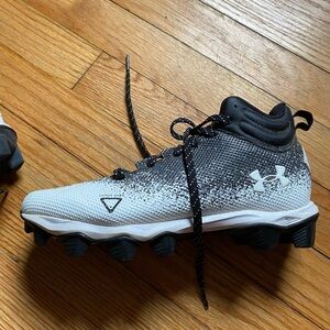 Youth under armor football cleats.